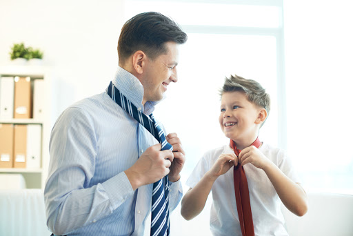 Happy boy and his father tying neckties &#8211; es