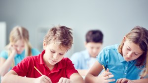 web-boy-girl-school-writing-pressmastershuuterstock