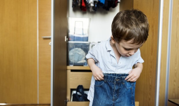 BOY DRESSING UP