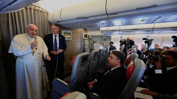 Pope-Francis-addresses-journalists-as-he-boards-a-flight-to-Edmonton-International-Airport-in-Alberta-western-Canad-AFP