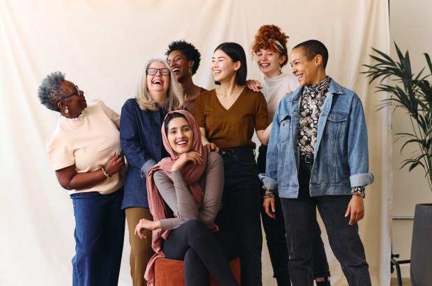 Portrait of cheerful mixed age range multi-ethnic women celebrating International Women's Day