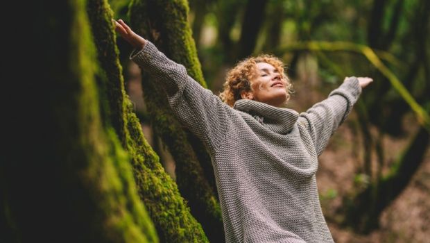 happy woman enjoying the green beautiful nature