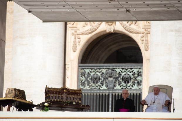 Pope Francis stands by the relics of Saint Therese of Lisieux
