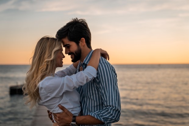 Lovely couple bonding at the beach in summer