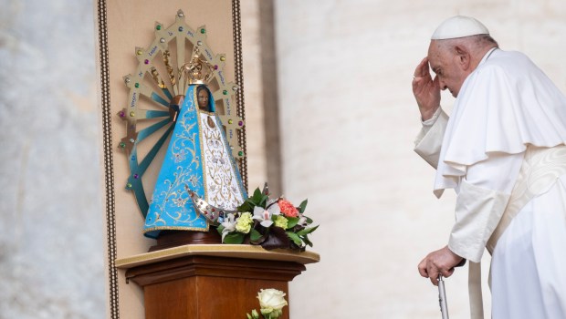 Pope Francis touches a statue of Our Lady of Lujan, during the weekly general audience on May 8, 2024 at St Peter's square in The Vatican.