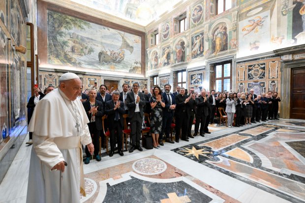 This photo taken and handout on June 14, 2024 by The Vatican Media shows Pope Francis during an audience with comedians in The Vatican.