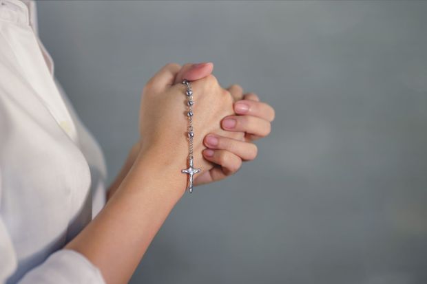 woman with rosary